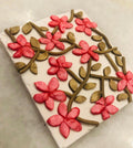 Blossom Trellis Pendant: white rectangle with coral blossoms on bronze vines