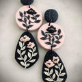 Blush and Noir Drops: three-tier earrings in blush pink and black with floral vines