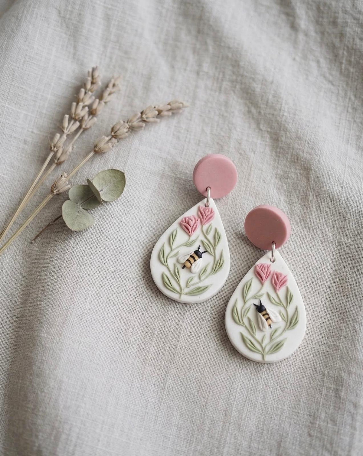 Honeybee Garden Drops: white teardrop earrings with a bee and pink flowers