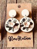 Magnolia Drops: white round earrings with a cream magnolia on a NavRatna card