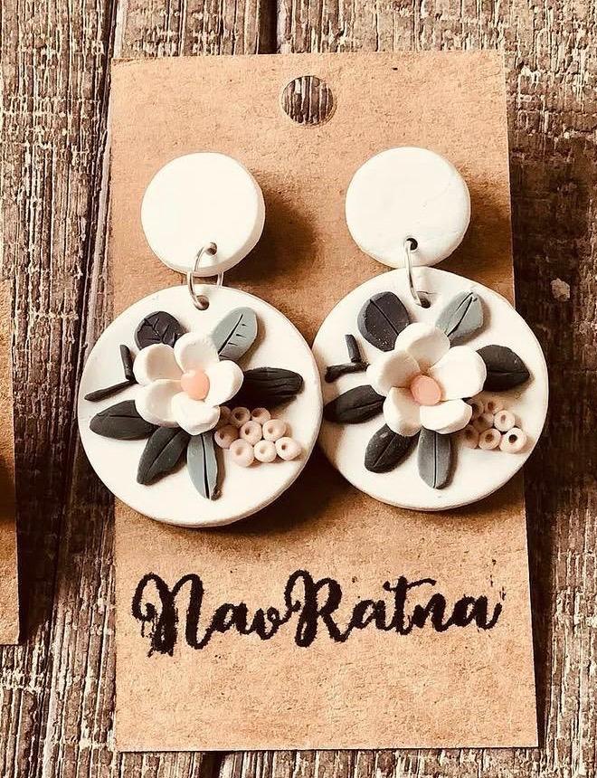 Magnolia Drops: white round earrings with a cream magnolia on a NavRatna card