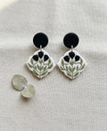 Noir Tulip Drops: scalloped white earrings with black tulips and black studs