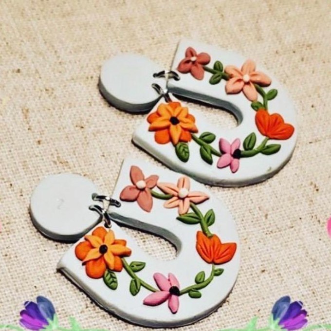 Wildflower Arch Earrings: white arch earrings with a vine of orange and pink flowers